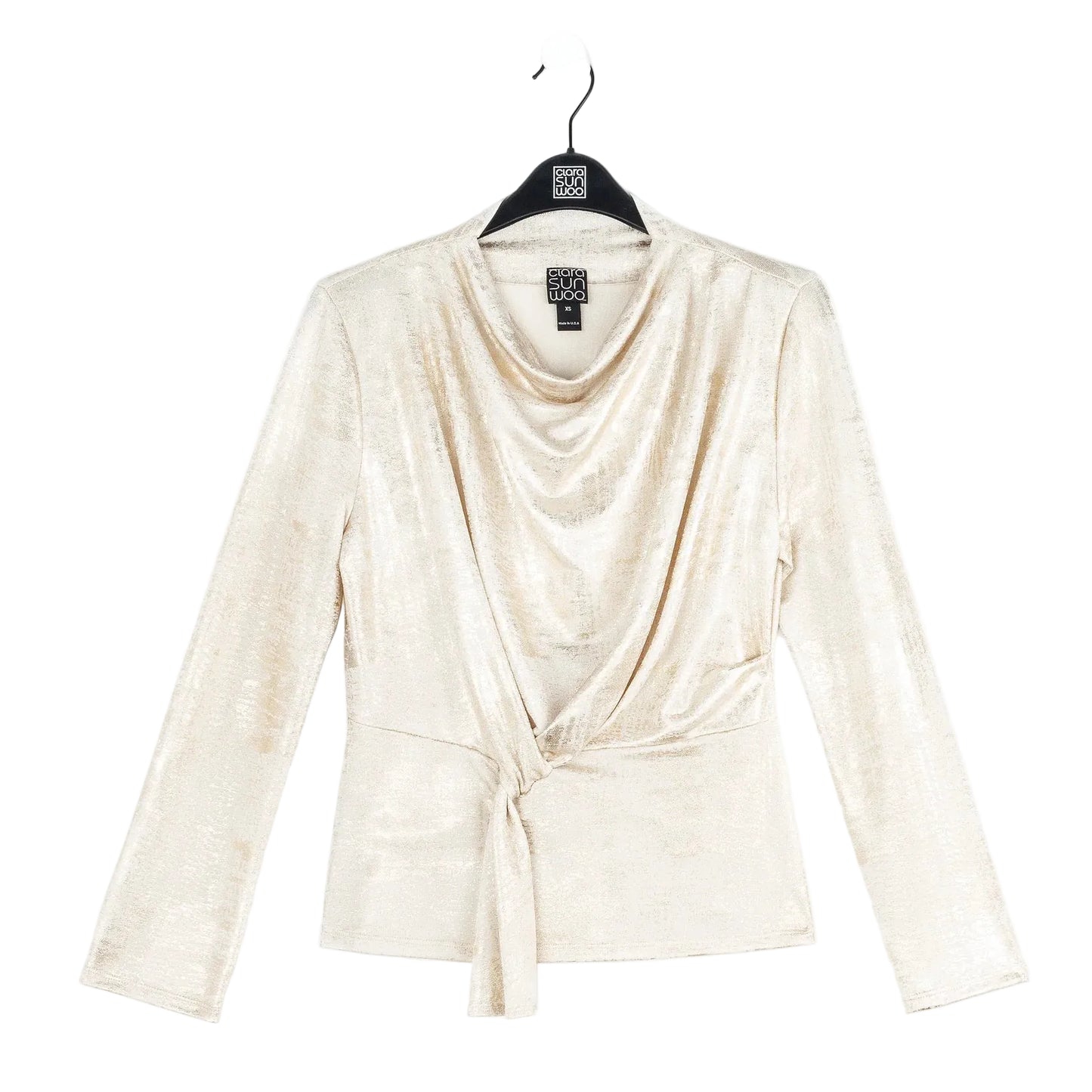 Beige long-sleeve top on a hanger with a white background