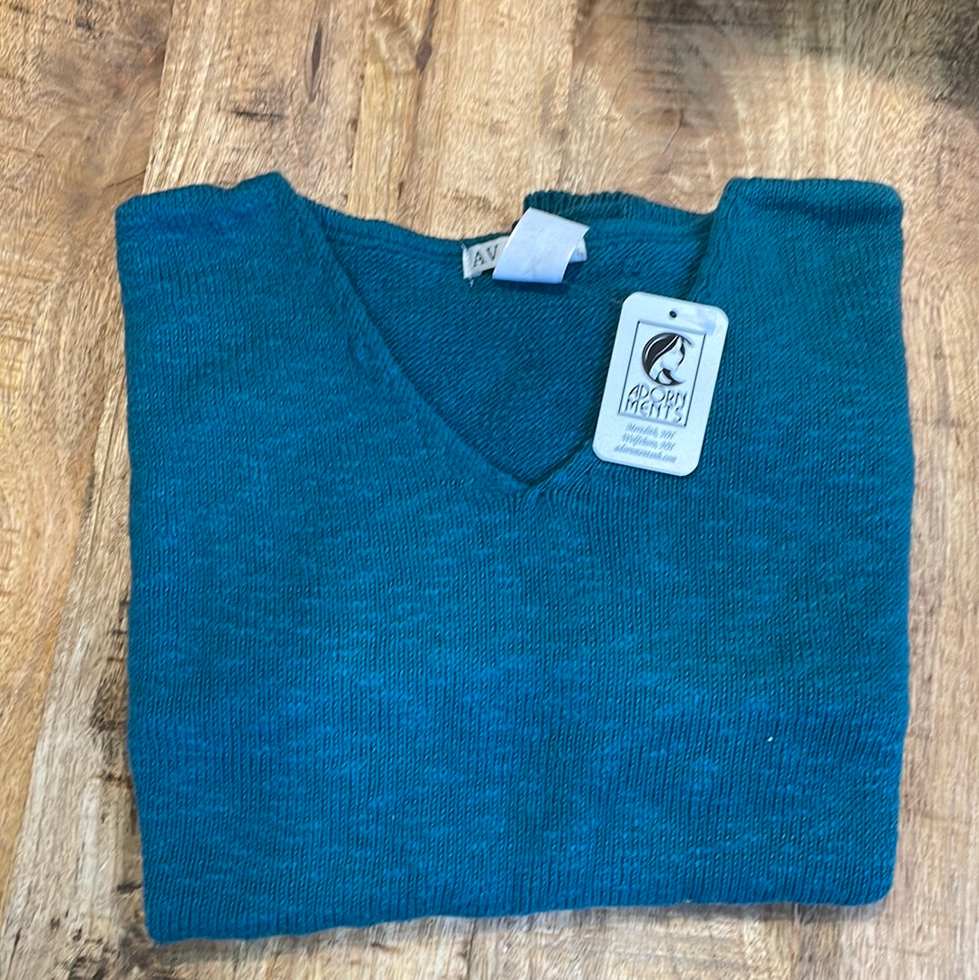 100% cotton slub sweater by Avalin. In color peacock green with long sleeves, v-neck,  straight hem with ribbed edges. Semi-crop style falls just below the belt. Made in USA.