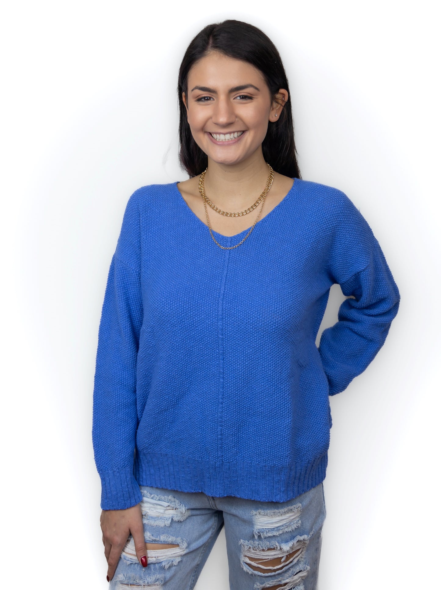 Ocean blue. 100% cotton slub seed stitch sweater by Avalin. Features long sleeves, v-neck, center seam, ribbed cuffs and ribbed straight hem with side slits. Falls just below mid hip.