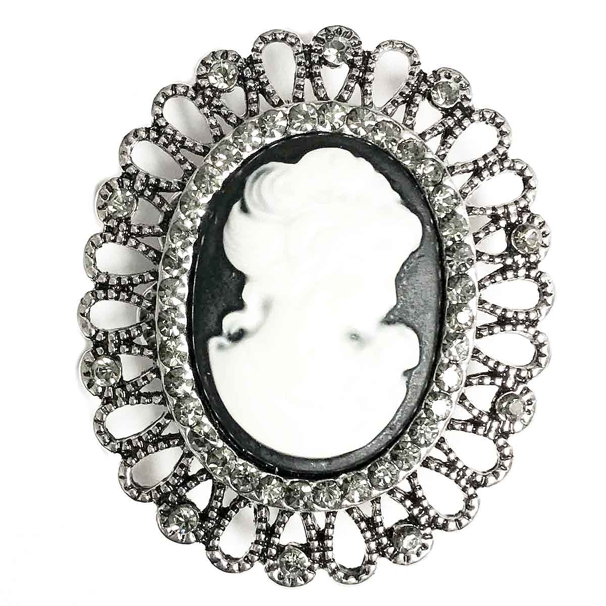 White cameo on black set in antique-like crystal loop. Oval. Magnetic Brooch for Scarves Artistic Sculptural shapes add a personality to absolutely anything you wish to put your stamp on! The Super Strong Magnet is enough for a jacket lapel! Use to hold a sarong or cardigan together.  Great to adorn a hat or to hold a scarf in place with Fabric Safe Magnet.
