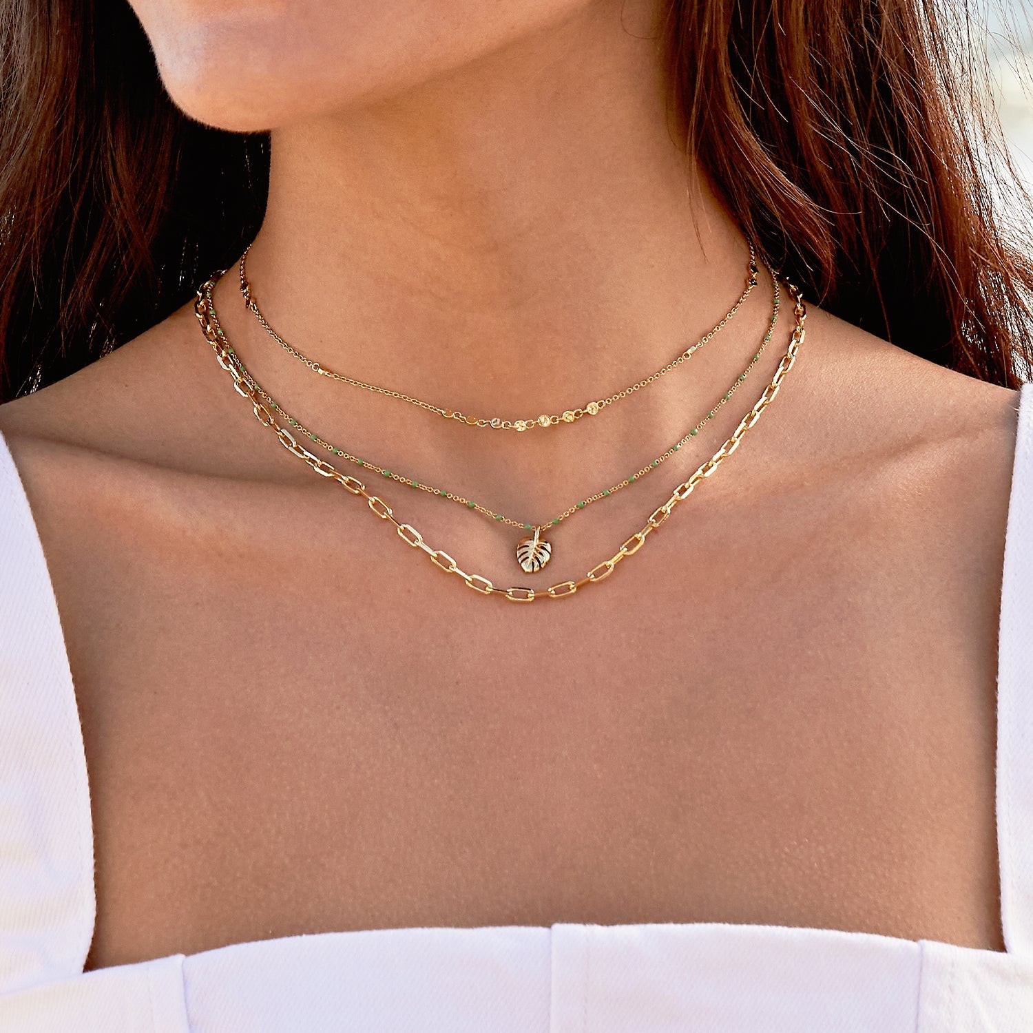 Delicate gold plated choker with little disk accents. by Gorjana