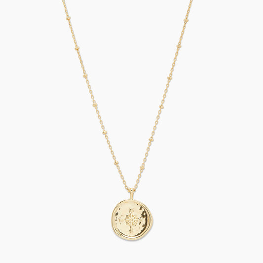 This 18k gold plate on brass necklace with mini golden beads throughout the chain and a stamped compass pendant to guide your journey. A timeless piece of jewelry, perfect for everyday wear — crafted from 18k gold plated brass for a luxe, durable finish.
