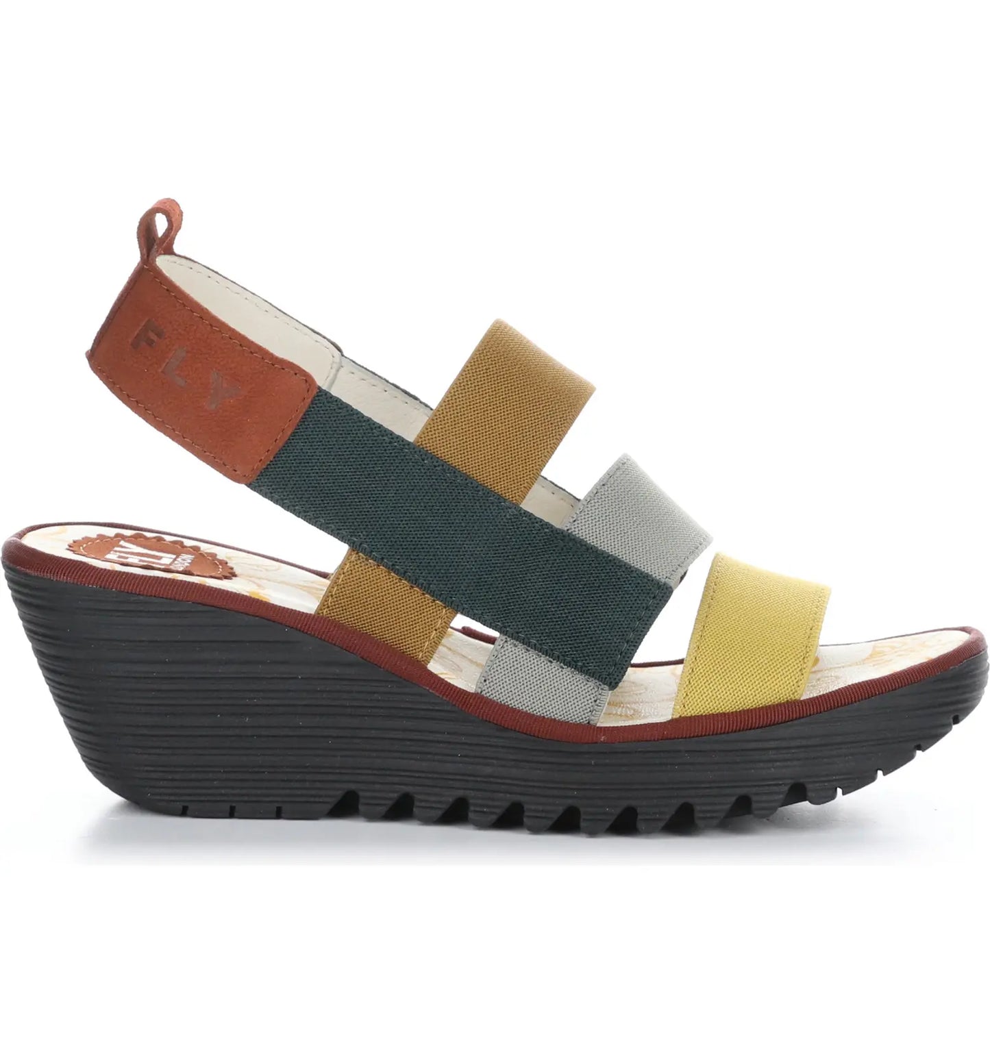 Fly London slip-on, fully leather lined sandal offers a black, shock absorbing 2.5 inch wedge sole, stretchy comfortable fabric straps in lovely autumn tones.   Made in Portugal