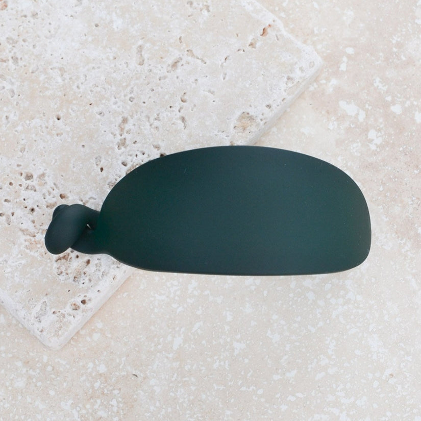 This hair clip is crafted from 100% acrylic and features a unique egg shape and matte finish. Measuring in at 2" x 1" x 1", this clip is secured with a twist closure.
