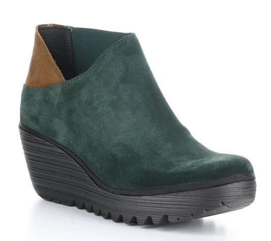 Featuring a forest green suede upper and rubber sole, this Fly London bootie is crafted in Portugal. Forest green suede bootie on rubber sole. Made in Portugal. Crafted from high-quality suede with robust rubber sole, these booties are designed to last. Perfect for any occasion, they provide both comfort and style.