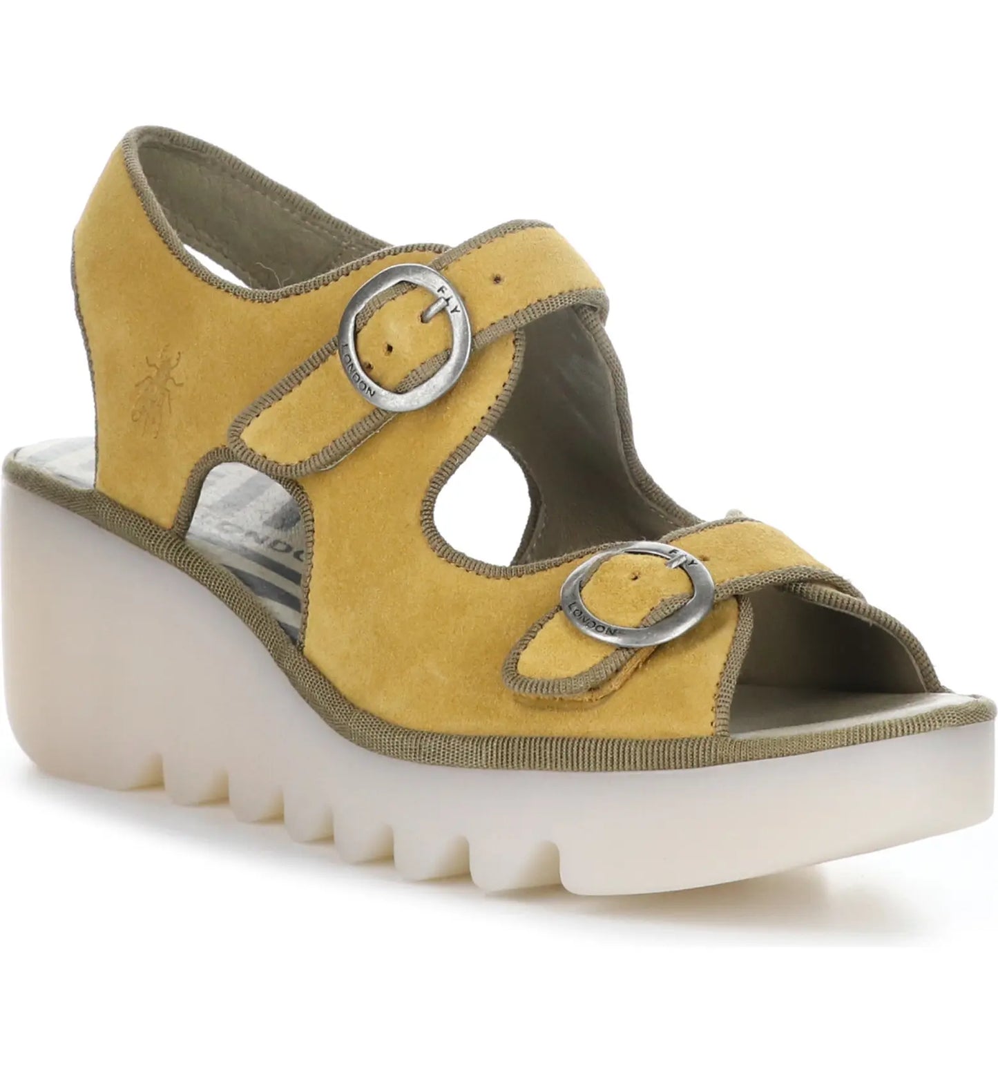 Featuring a hook and loop adjustable upper strap and buckle lower strap, the Fly London golden honey suede leather sandal is set upon a 3 inch shock-attenuating wedge sole crafted in Portugal.