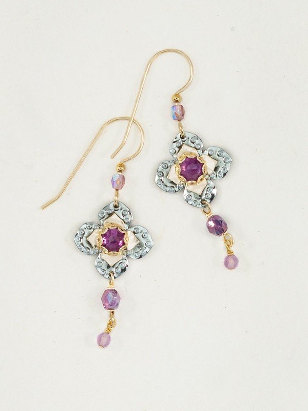 Experience the exquisite beauty of these Holly Yashi Royal Courtship Earrings. Each graceful sage flower is delicately set with an Amethyst gemstone and shimmering Czech Crystals, flawlessly encapsulating an aura of timeless elegance. Handcrafted in California with a gold fill wire, these earrings capture a sophistication that embodies luxury.