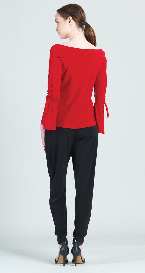 Red Cross Shoulder Top. Clara Sunwoo beautifully red, long sleeve boat neck top with ruched bell sleeve with tie detail. 70% Polyester, 20% Rayon, 10% Spandex Made in USA.
