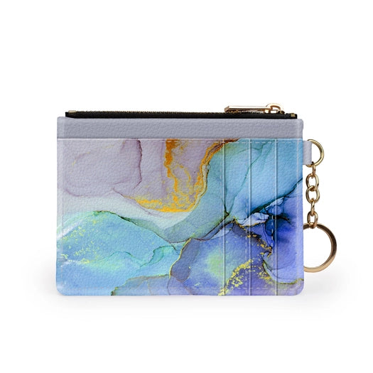 RFID Credit Card Wallet  with zipper pouch and gold tone key chain. Blue, yellow, purple marble print on vegan leather. Size 5 inches by 3 1/4 inches