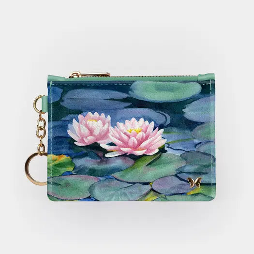 his nature and art inspired wallet is textured vegan leather featuring three card slots, an additional pocket for larger paper items and a zippered center pocket. The gold toned chain and keyring provides easy access for keys. The RFID blocking technology will protect against identity theft.   Dimensions 5  x 3.25 inches