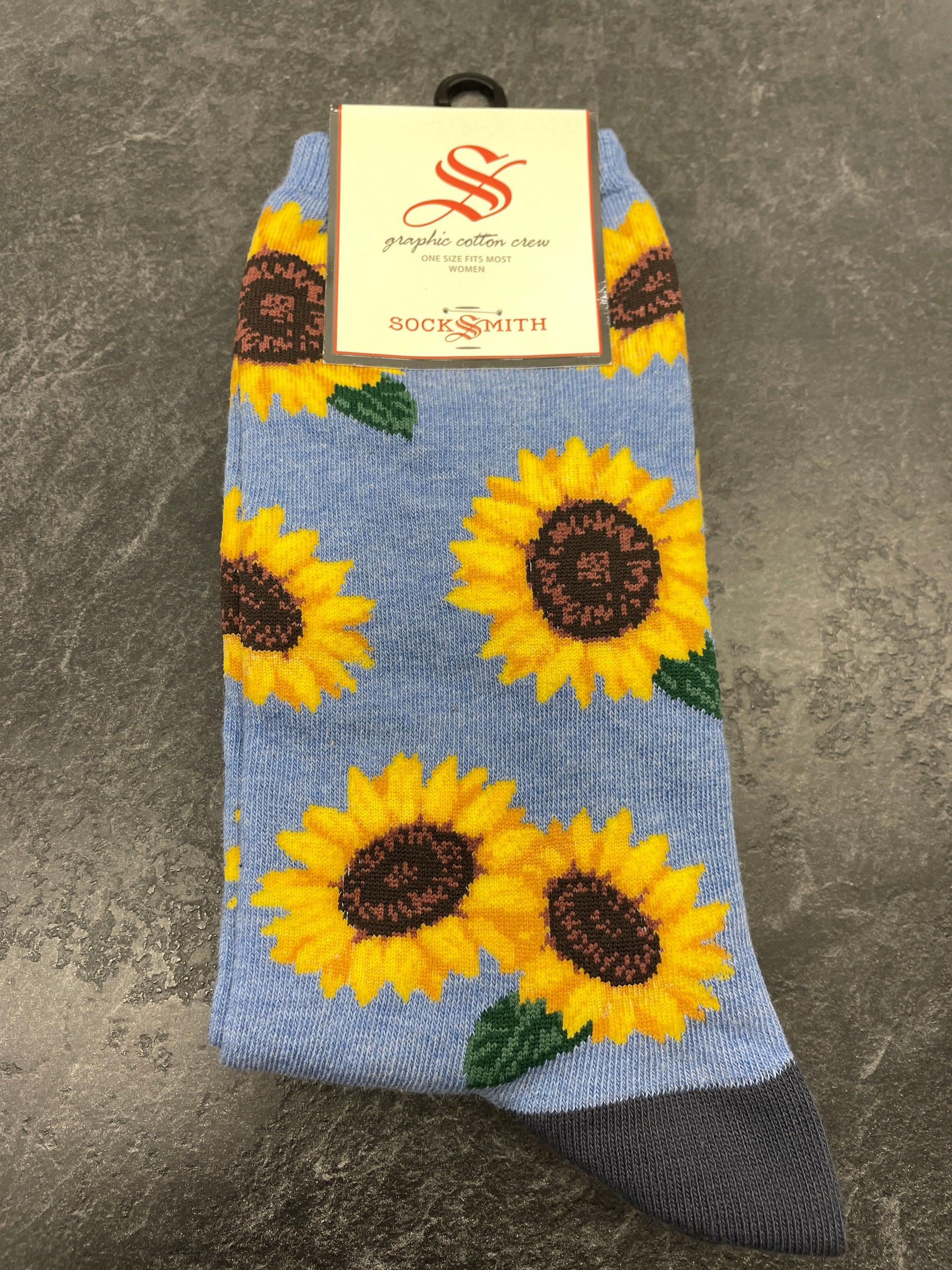 Crew sock with yellow sunflowers on a sky blue background. Grey Heel and toe sock.
