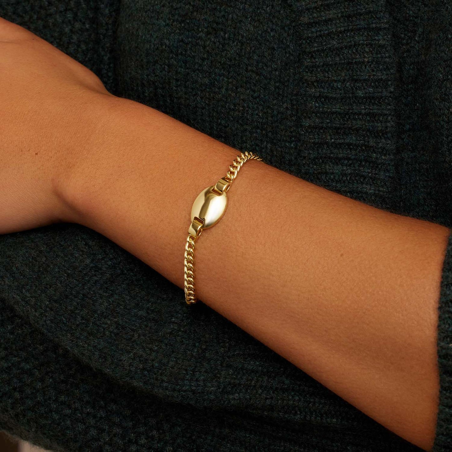 The Lou Tag Bracelet features a modern link crafted from 18k gold plated brass and a statement tag charm, designed and crafted by the Californian designer, Gorjana. This luxurious bracelet is connected with a reliable clasp, made to provide lasting quality with a modern, chic aesthetic.
